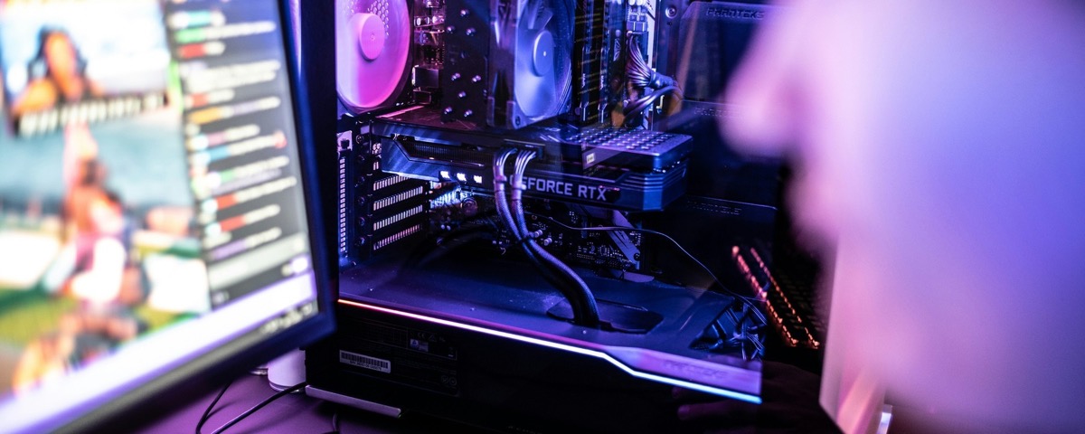 A player uses a computer in a professional gaming space.